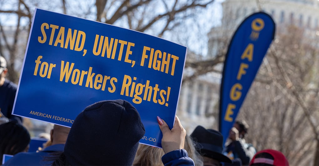 AFGE Stand, Unite, Fight graphic accompanying a report on a union representation arbitration win.